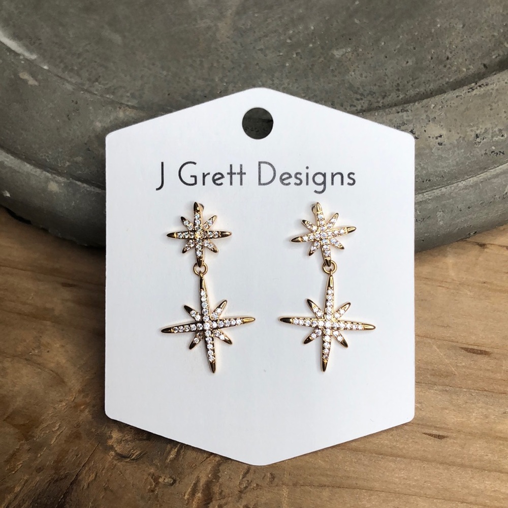 Gold and crystal star dangle earrings